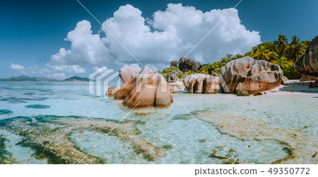 Impressive cloudscape at beautiful Anse Source d'Argent beach, La Digue Island, Seychelles 49350772