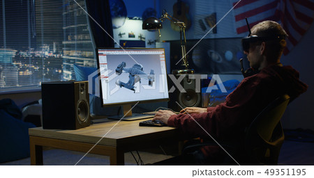 Man designing airplane on a computer Man designing airplane on a computer 49351195