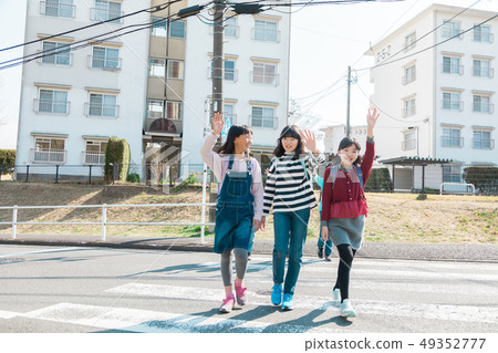 Primary school student attending school after school Crosswalk Primary school student attending school after school Crosswalk 49352777