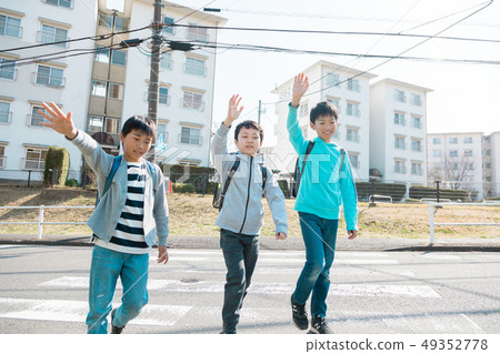 Primary school student attending school after school Crosswalk Primary school student attending school after school Crosswalk 49352778