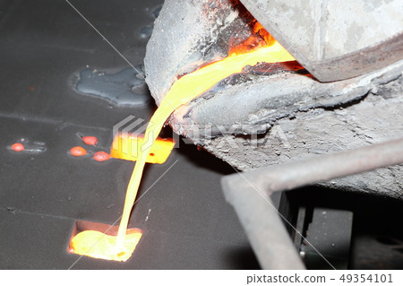 Iron molten metal pouring in sand mold Iron molten metal pouring in sand mold 49354101