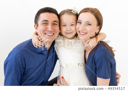 people, family and happiness concept - Mother and father with little daughter over white background people, family and happiness concept - Mother and father with little daughter over white background 49354517