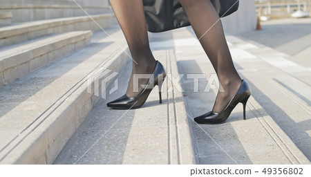 businesswoman commuting and walking 49356802