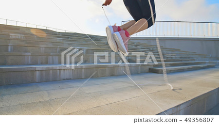 woman sport and rope skipping 49356807