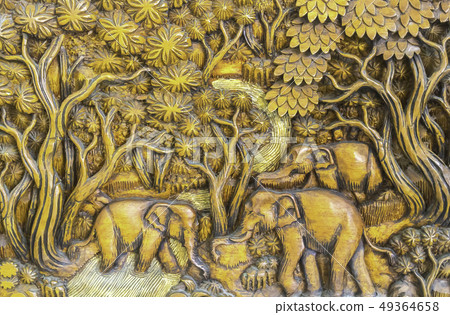 Elephants in forest tradional wooden craving backg 49364658