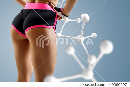 Athletic woman standing near white molecule chain. Athletic woman standing near white molecule chain. 49366997