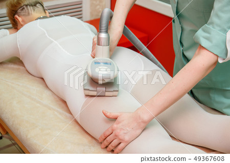 Woman having procedure of anti cellulite lpg Woman having procedure of anti cellulite lpg 49367608