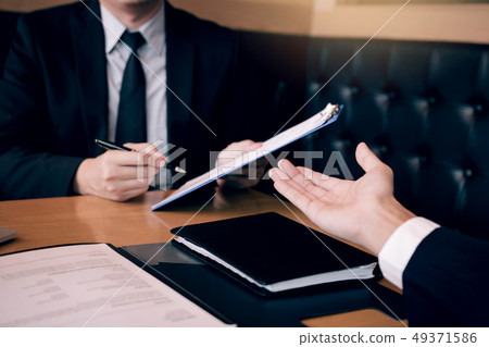 Interview in the office room with managers and Interview in the office room with managers and 49371586