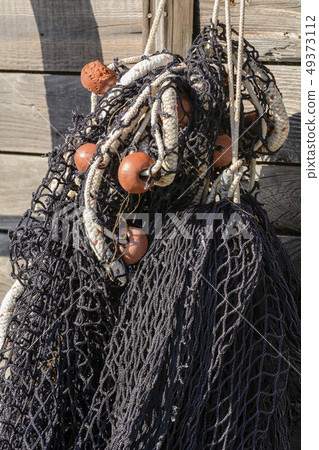 Detail of black fishing net. Detail of black fishing net. 49373112