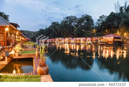 Tropical wooden raft resort illumination on river 49373537