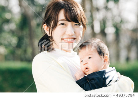 Mother holding a baby Park Walk Parenting 49373794