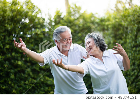 Asian Couple practicing Tai Chi. 49374151
