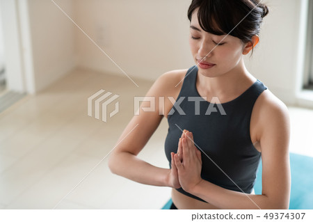 Young woman doing yoga Japanese meditation concentration Young woman doing yoga Japanese meditation concentration 49374307