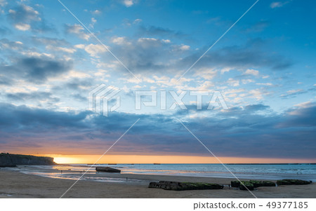 Remains of the Mulberry Harbours on the beach 49377185