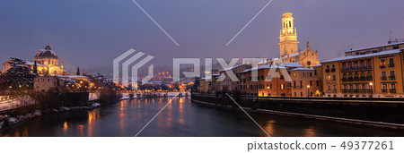 Verona at night with snow - Adige river Italy 49377261