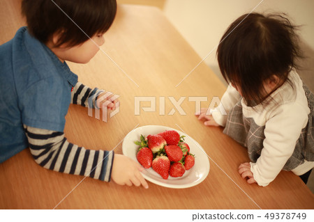 Children eating strawberries Children eating strawberries 49378749