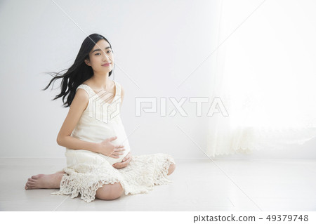 Young pregnant woman Young pregnant woman 49379748