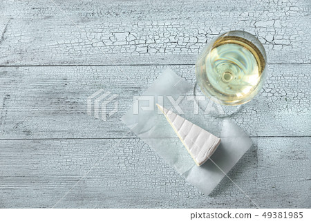 Glass of white wine with Brie Glass of white wine with Brie 49381985