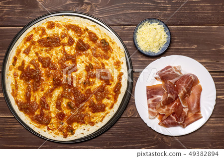 Recipe of pizza capriciosa on brown wood 49382894