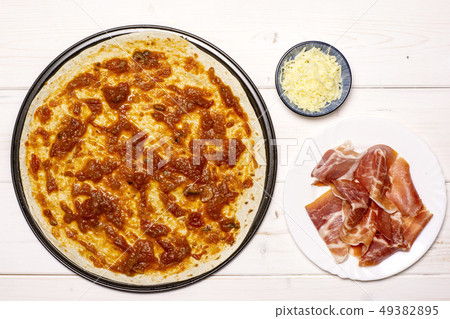 Recipe of pizza capriciosa on grey wood Recipe of pizza capriciosa on grey wood 49382895