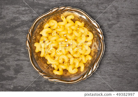 Cavatappi pasta raw on grey stone 49382997