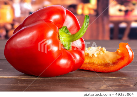 Fresh red paprika with rustic kitchen Fresh red paprika with rustic kitchen 49383004