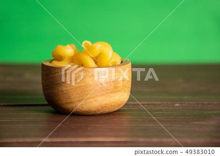 Cavatappi pasta raw with green screen 49383010