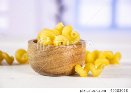Cavatappi pasta raw with blue window Cavatappi pasta raw with blue window 49383018