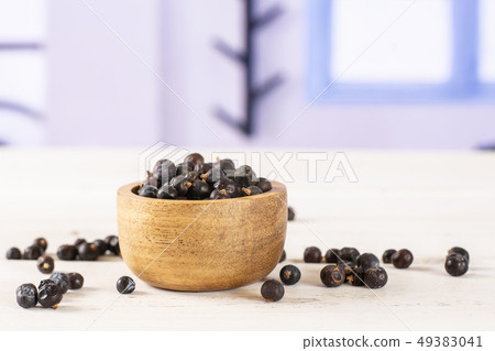 Dry juniper berries with blue window 49383041