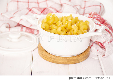 Cavatappi pasta raw on grey wood 49383054