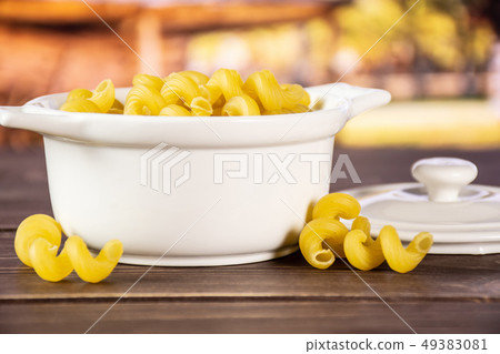 Cavatappi pasta raw with cart Cavatappi pasta raw with cart 49383081