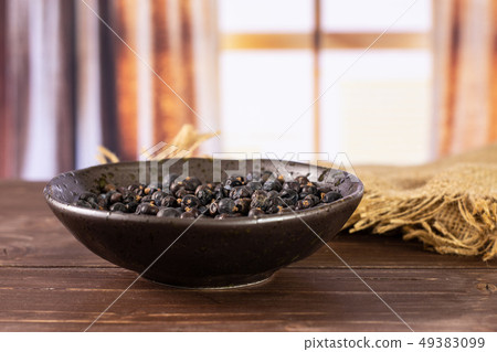 Dry juniper berries with curtains 49383099