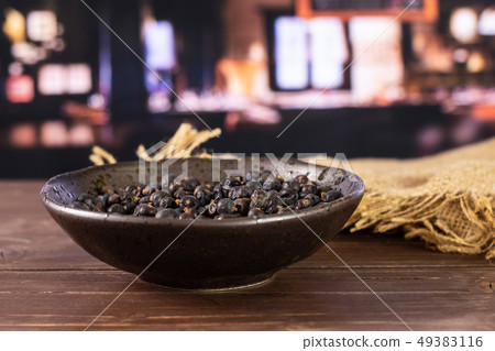 Dry juniper berries with restaurant 49383116