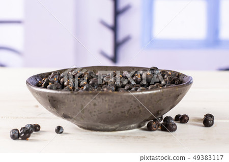 Dry juniper berries with blue window 49383117