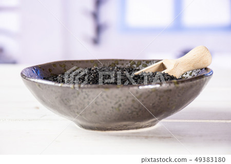 Black cumin seeds with blue window Black cumin seeds with blue window 49383180