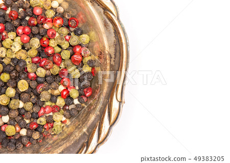 Four colors of peppercorns isolated on white Four colors of peppercorns isolated on white 49383205