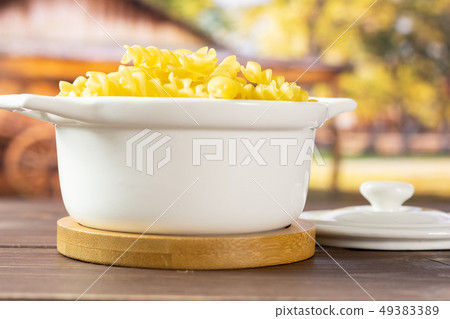 Raw italian torti pasta with cart Raw italian torti pasta with cart 49383389