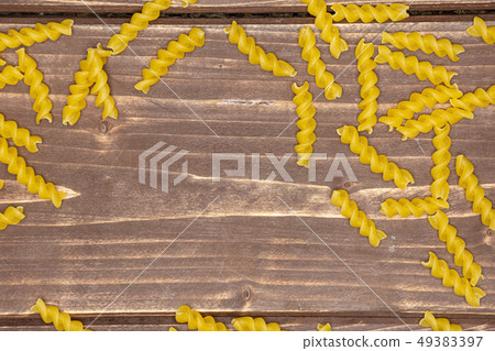 Raw italian torti pasta on brown wood 49383397