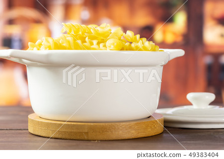 Raw italian torti pasta with rustic kitchen Raw italian torti pasta with rustic kitchen 49383404