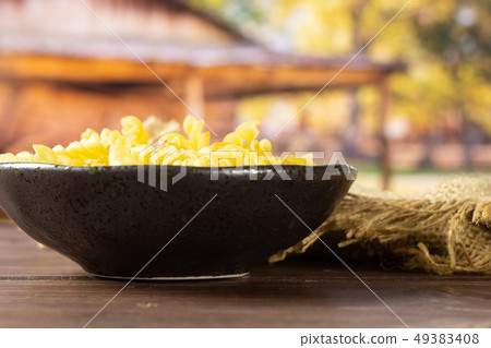 Raw italian torti pasta with cart Raw italian torti pasta with cart 49383408