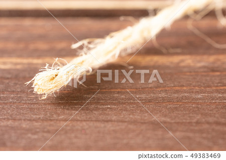 Yellow simple pencil on brown wood Yellow simple pencil on brown wood 49383469