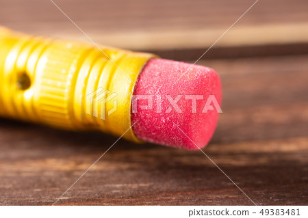 Yellow simple pencil on brown wood Yellow simple pencil on brown wood 49383481