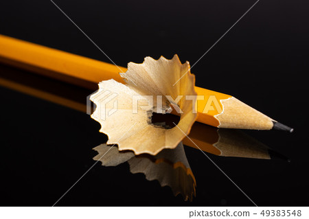 Yellow simple pencil isolated on black glass Yellow simple pencil isolated on black glass 49383548