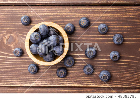Fresh sweet blueberry on brown wood 49383783