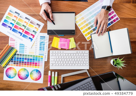 Image of male creative graphic designer working on 49384779