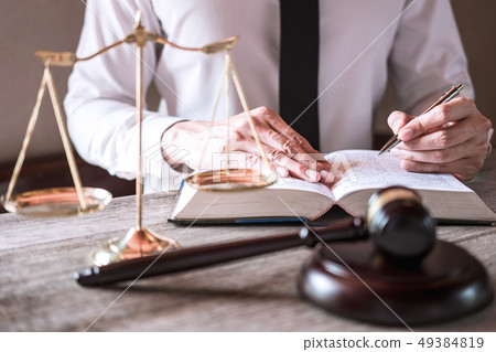 Male lawyer or judge working with Law books, gavel 49384819
