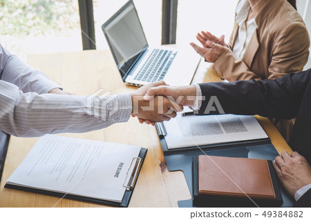 Greeting new colleagues, Handshake while job Greeting new colleagues, Handshake while job 49384882