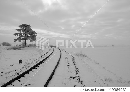 Single railway track in winter landscape. Czech 49384981