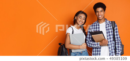 Education concept. Students holding exercise books, empty space 49385109