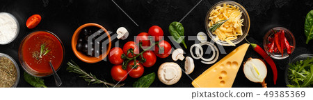 Pizza cooking ingredients, vegetables and cheese, top view Pizza cooking ingredients, vegetables and cheese, top view 49385369